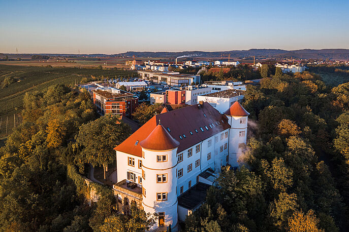 Hohenstein headquarters castle on a hill with modern lab buildings