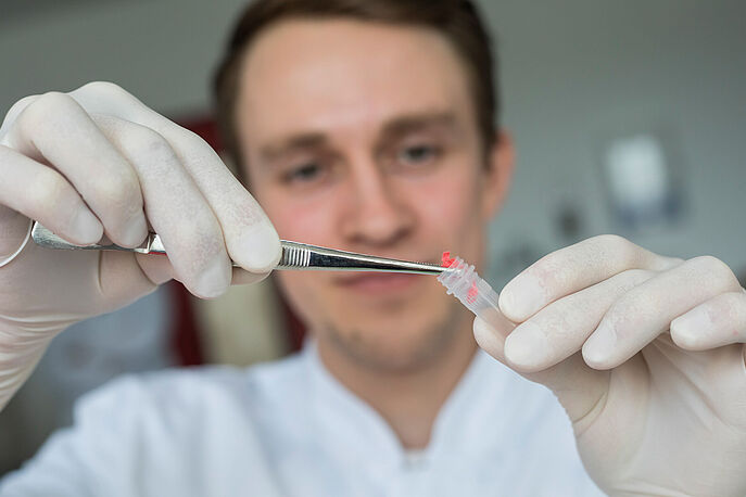 DNA Analysis of Cotton for GMO Detection at Hohenstein Hohenstein microbiologist extracts DNA from cotton in test tube