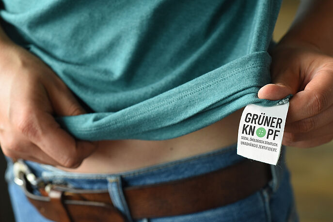 Green Button tag on Shirt