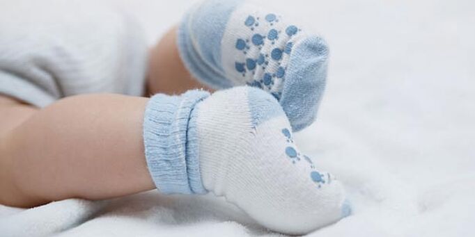 Baby wearing non-toxic, blue socks