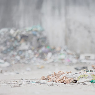 Piles of discarded textiles on a beach