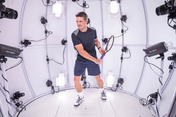 Tennis player in a 4D scanner at Hohenstein Fit Lab