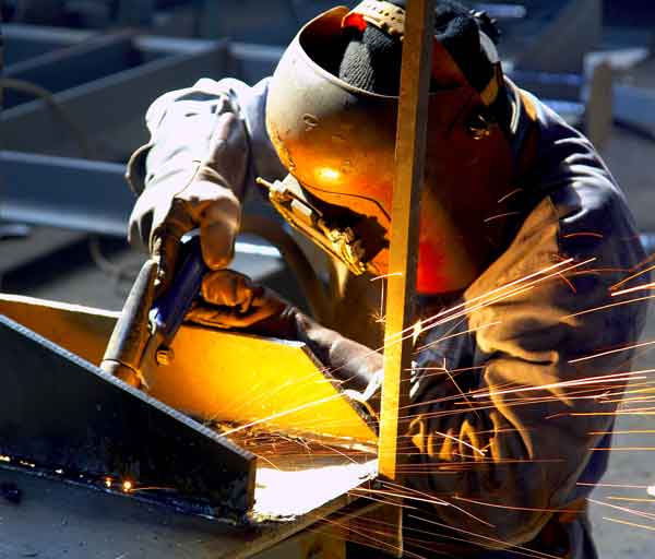 Artificial UV Radiation from Welding welder wearing PPE designed for UV protection